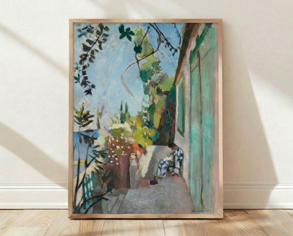 Framed poster of Henri Matisse's The Terrace St Tropez, featuring bright abstracted Mediterranean landscape with bold geometric shapes in vibrant blues, greens, and warm yellows.