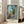 Modern impressionist art print of a coastal St Tropez scene with white buildings, cobalt sea, and golden light evoking Mediterranean tranquility.