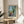 Matisse landscape poster showing a bright terrace overlooking St Tropez harbor, featuring a palette of blues, yellows, greens, and warm earth tones.