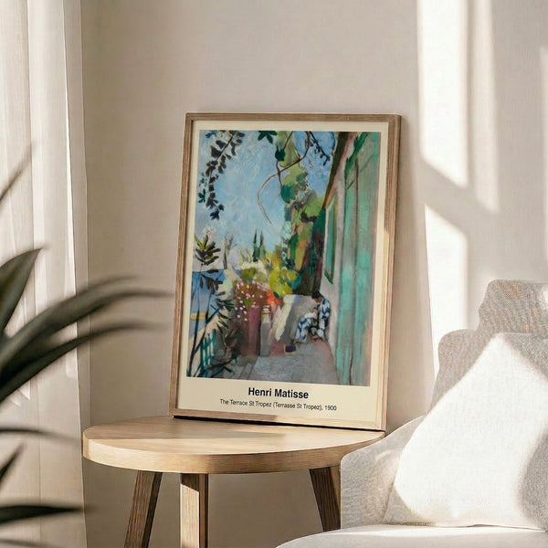 Matisse landscape poster showing a bright terrace overlooking St Tropez harbor, featuring a palette of blues, yellows, greens, and warm earth tones.