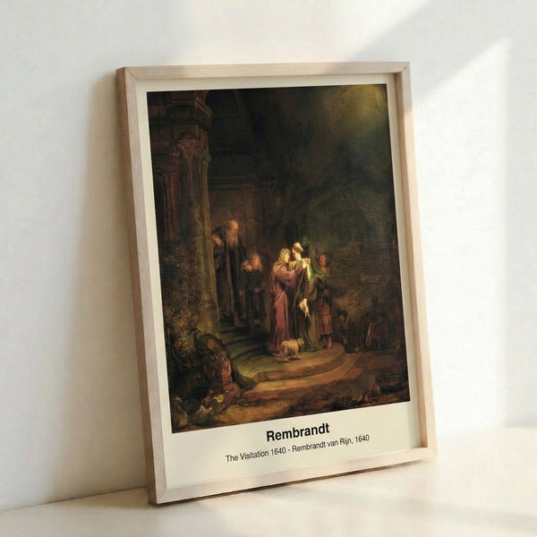 The Visitation by Rembrandt: a warm, dramatic biblical narrative painting in cream, gold, and brown hues depicting figures in a dimly lit chamber.