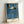 Framed abstract window poster with subdued blue and black palette, embodying quiet introspection and contemporary minimalist design.