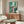 Framed modern masterpiece print showing an imaginative take on window forms through simplified color blocks and organic shapes in soothing hues.