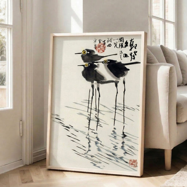 Japanese-inspired sumi-e print of graceful wading birds among water and vegetation, rendered in traditional black and gray tones with serene, understated beauty.