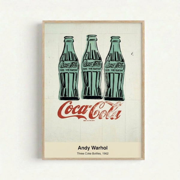 Framed modern art print displaying three classic Coke bottles in stark green and black tones, embodying pop art's celebration of consumer culture.