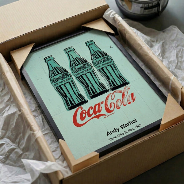 Framed pop art print of three classic bottles in striking green, black, and white, celebrating commercial imagery with mechanistic, bold design.