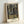 Contemplative Impressionist scene of ballet dancers at rest in a mirrored exercise room, composed with soft warm and cool hues that evoke a quiet moment of artistic study.