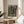 Impressionist wall art depicting graceful dancers in an exercise studio, achieved through delicate brushwork in cream, ochre, pale blue, and soft brown pigments.