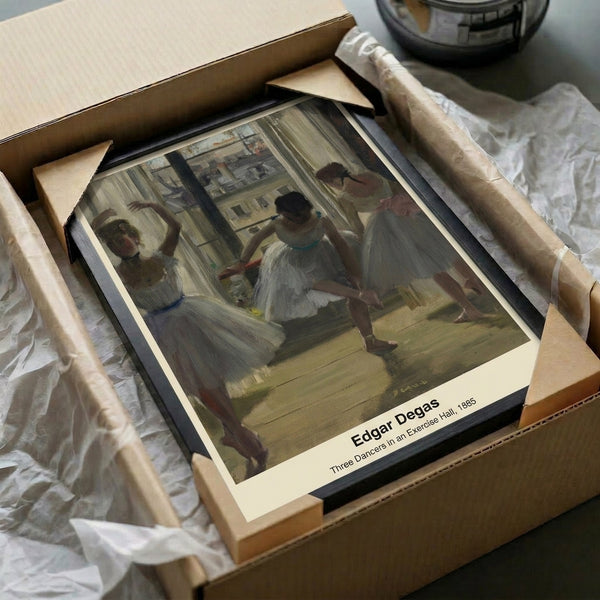 Framed Impressionist masterpiece of ballet dancers captured in a contemplative moment at the studio mirror, painted with atmospheric softness in muted warm and cool tones.