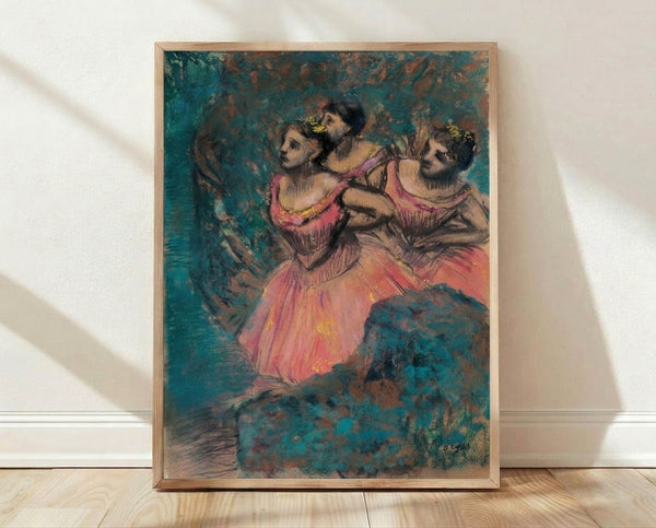 Framed vintage ballet poster featuring three dancers in flowing red costumes, rendered in soft impressionist brushstrokes with warm earth tones and delicate pastel accents.