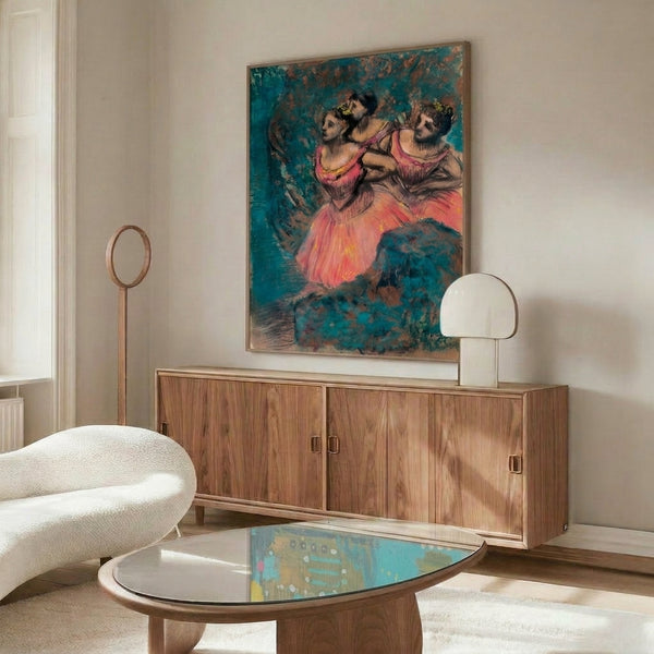 Wall art print depicting three graceful dancers in deep red performance costumes, rendered in impressionistic brushstrokes with refined tonal palette of golds and neutral hues.