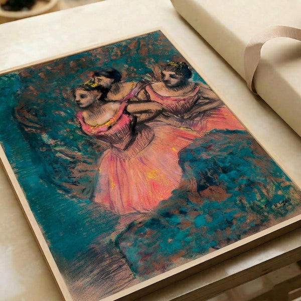 Framed impressionist ballet scene showing three dancers in flowing red garments, composed with soft gestural marks and a sophisticated warm-toned color scheme.