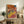 Three dancers in yellow skirts portrayed in soft Impressionist style with peachy and golden tones, nostalgic ballet-themed framed artwork for walls.