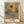 Abstract expressionist painting featuring three distorted human figures and a portrait rendered in ochre, brown, and grey tones, evoking a sense of anguish and claustrophobia framed on a wall.