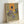 Expressionist framed poster depicting faceless figures in geometric abstraction with ochre and grey hues, capturing an anguished and haunting mood.