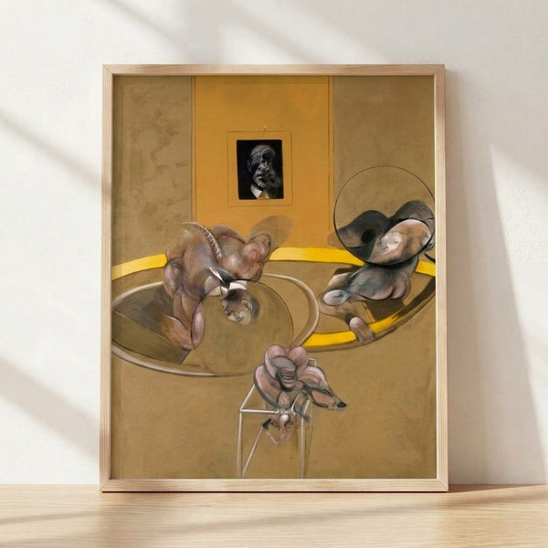 Abstract portrait poster featuring three distorted figures and a fragmented face in muted earth tones and grays, creating an unsettling, existential mood on a framed gallery wall.