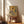 Framed modern art print of three expressive, abstracted human forms alongside a deconstructed portrait in somber browns and creams, evoking psychological tension.