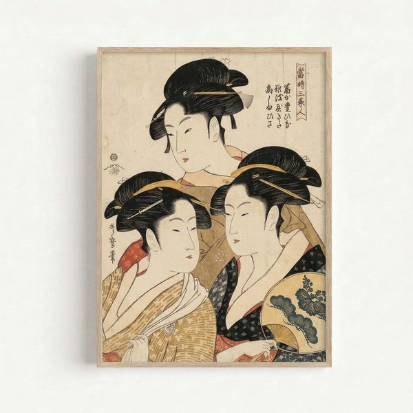 Ukiyo-e style wall art depicting three serene geisha figures adorned in patterned kimonos, fans, and decorative hairpieces, executed in a sophisticated palette of cream, tan, black, and gold.