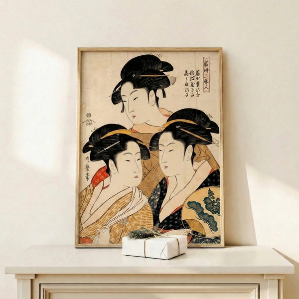 Elegant Japandi wall print presenting three poised geisha portraits in ornate kimonos and traditional styling, with a serene mood captured through cream, gold, black, and red color tones.