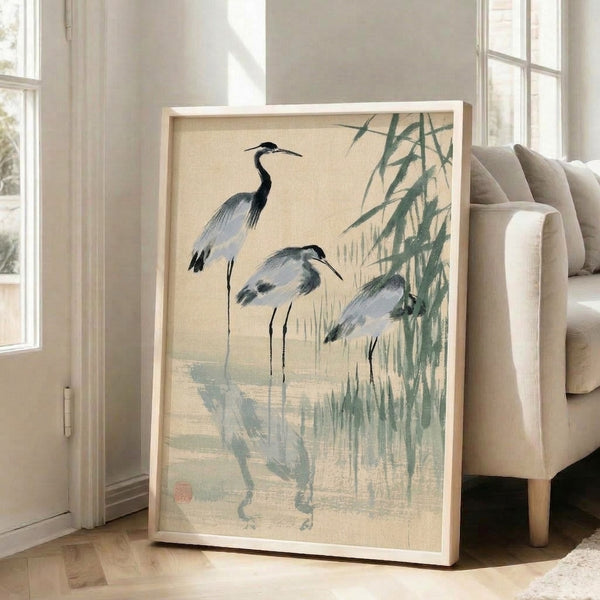 Contemplative Japandi poster featuring three wading birds in a minimalist marsh landscape with soft gray and blue watercolor washes, displayed as a framed wall art.