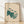 Minimalist line art poster of three barn owls in cream, teal, and warm brown tones, framed on a wall with a calm, serene aesthetic.