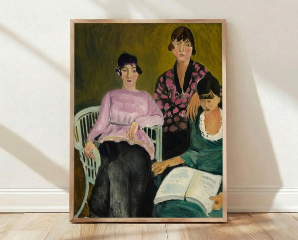 Framed modern portrait print of three female figures with bold, expressive brushwork in warm tones of ochre, rust, and cream against a muted background.