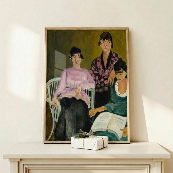 Modern portrait art print showing three sisters depicted with bold lines and warm ochre hues, hung as framed wall decor.