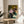 Wall art print featuring three stylized female portraits in warm, harmonious tones of ochre and cream with a modern expressionist aesthetic.