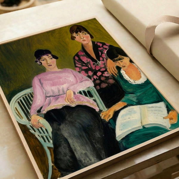 Framed contemporary portrait poster of three women rendered in bold strokes with warm russet and neutral tones throughout the composition.