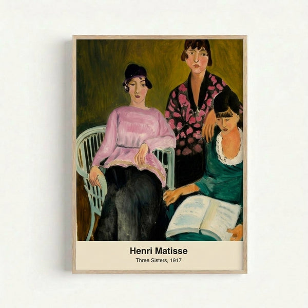 Framed poster of Matisse's 1917 work depicting three female figures in rust and cream hues, rendered with bold, gestural lines in the artist's distinctive modern style.