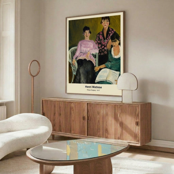 Framed gallery print of Matisse's 1917 Three Sisters, an intimate modernist portrait with cream, rust, and blue palette, boldly executed in the artist's Fauvist manner.