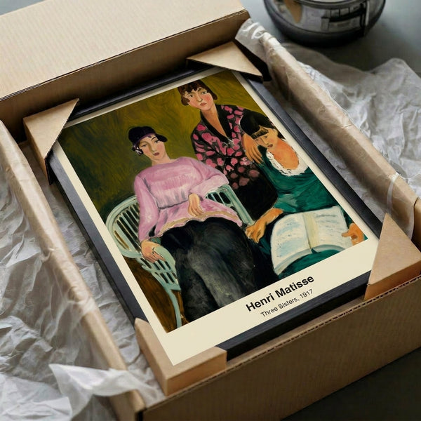 Three women portrayed in Matisse's modernist vision, this framed poster displays the artist's characteristic use of vibrant ochre and blue against cream, with expressive gestural marks.