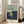 Modern three-part poster art featuring abstracted male figures viewed from behind, rendered in earthy ochres and greys with stark geometric forms evoking introspective, existential themes.