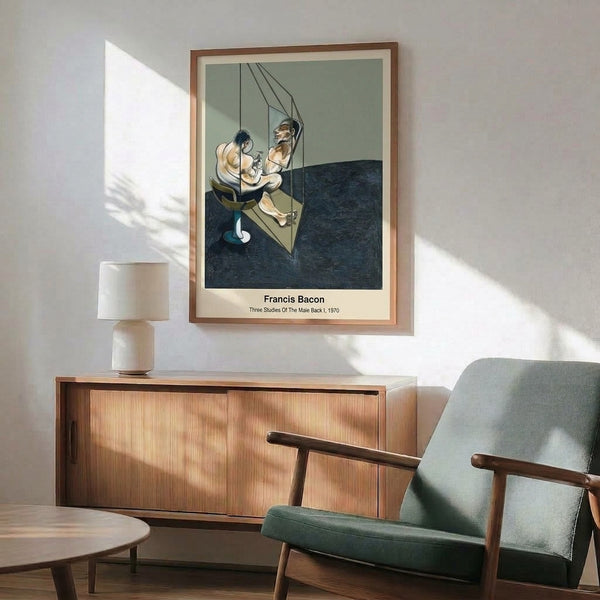 Contemporary framed print showing three abstracted male back studies in black, grey, and ochre with geometric pedestal and cage elements, conveying isolation and introspective mood.