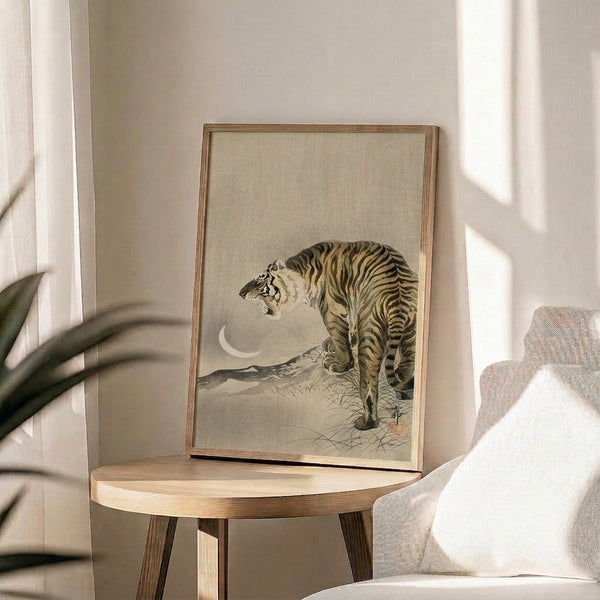 Zen-inspired poster print showing a tiger amid grass under a crescent moon, rendered in warm ochre and cream tones with bold black accents.