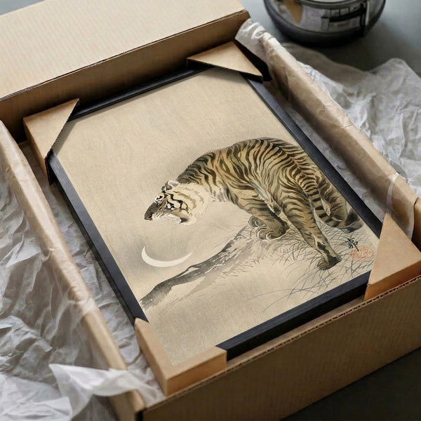 Minimalist wall art print portraying a serene tiger under moonlight in traditional woodblock style with muted cream, black, and ochre hues.