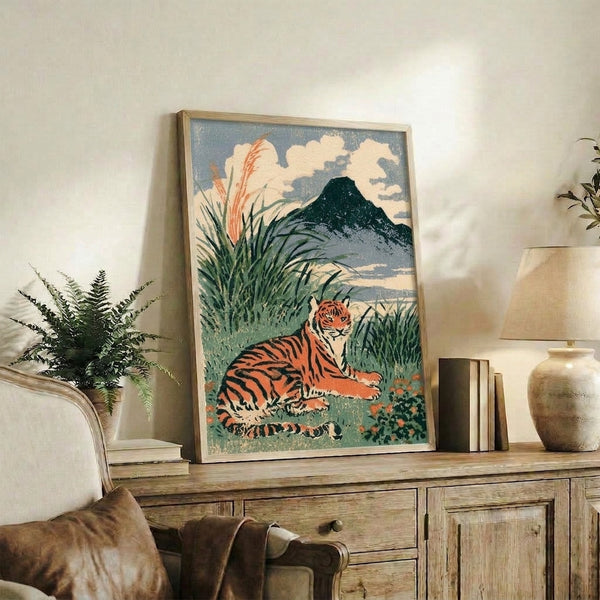 Vintage ukiyo-e inspired art print on wall showing a serene tiger landscape with burnt orange accents, misty mountains, and blooming flora in muted earth tones.