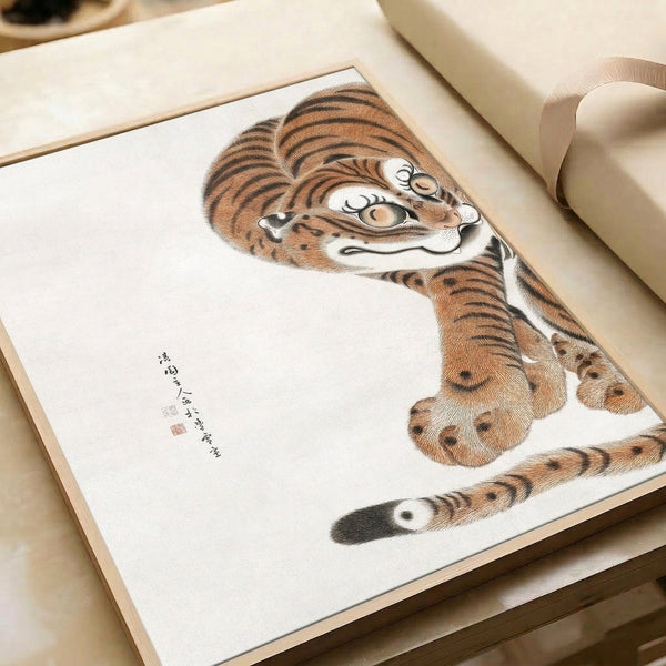 Traditional Japanese woodblock tiger artwork with contemplative mood, showing detailed ink work and curled composition in cream, tan, black, and burnt orange.