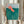 Vintage-style woodblock art of a dynamic tiger in motion amid serene botanical elements including water plants and fungi in coral, teal, and soft green tones.