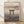 Minimalist Japanese woodblock-style framed poster featuring a torii gate silhouetted against a full moon reflected in still water, rendered in cream, gray, and charcoal tones.
