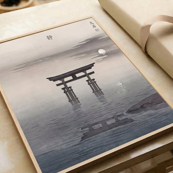 Zen-inspired framed print depicting a torii gate beneath a full moon with rippling water reflection, composed in a restrained palette of black, charcoal, and white.