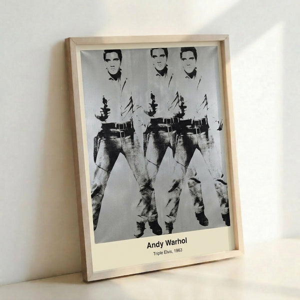Framed poster art displaying the King of Rock and Roll in three dynamic poses rendered in bright cyan, gold, and hot pink hues with bold black accents.