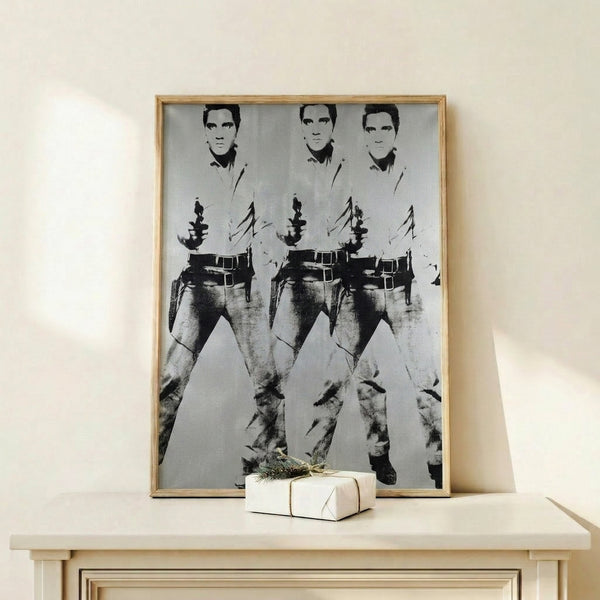 Contemporary pop art poster featuring triple images of Elvis in cowboy attire, rendered in the bold, simplified color palette and repetitive style of Andy Warhol's famous artwork.