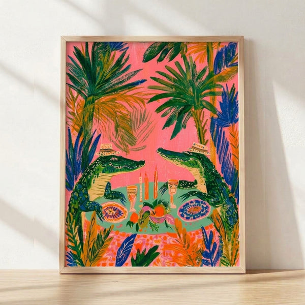 Whimsical boho poster of alligators gathered around a jungle dinner table with tropical fruits, candles, and palm leaves in vibrant coral pink, forest green, and golden yellow tones.
