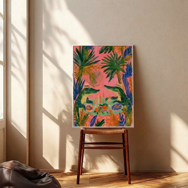 Vibrant framed poster showing an imaginative alligator feast in a palm jungle setting with candlelit table, ripe fruits, and layered greenery in cheerful boho colors.