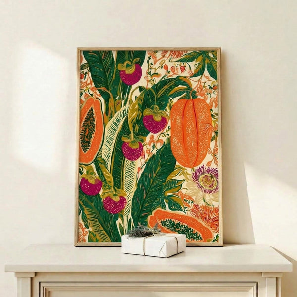 Framed boho wall art displaying tropical fruits and flowering vines in burnt orange, golden yellow, and deep green tones with organic Art Nouveau design.