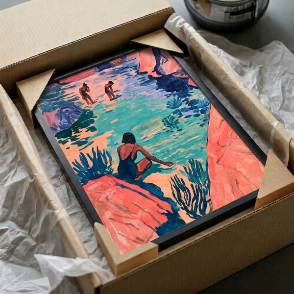 Framed watercolor painting of bathers enjoying a peaceful turquoise lagoon surrounded by natural rock formations in coral pink and sage green tones, ideal for coastal décor.