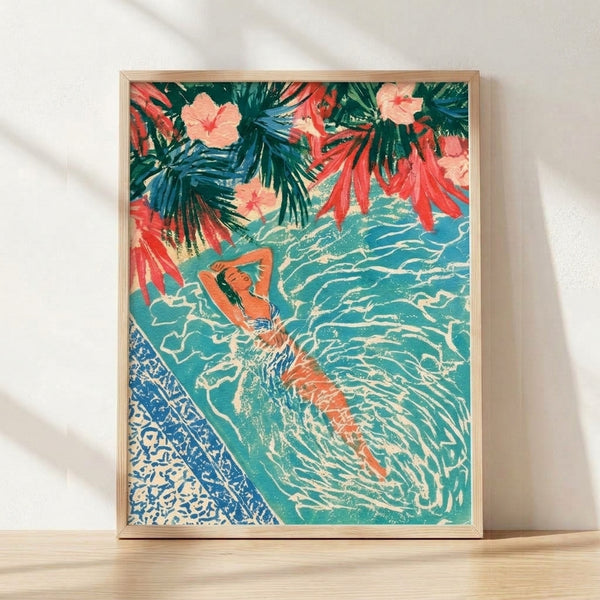 Framed retro poster art print featuring a woman in a tropical pool scene surrounded by palm fronds and flowers in turquoise, coral pink, and cream tones, evoking vintage leisure and escapism.