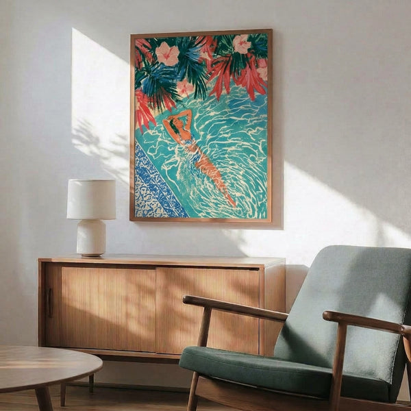 Vintage-style wall art depicting a dreamy swimmer in a lush tropical setting with forest green foliage and turquoise water, rendered in soft coral and navy accents for a nostalgic aesthetic.