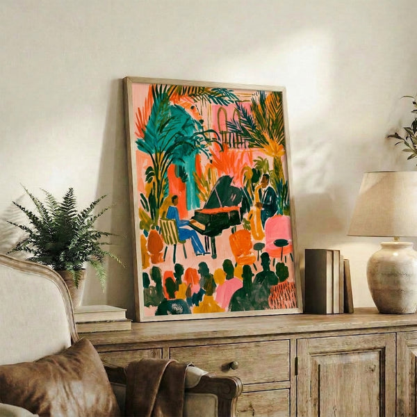 Colorful framed art print depicting an energetic jazz piano duet amid palm fronds and flowering plants, with warm summery hues of pink, coral, and teal creating a joyful, creative atmosphere.
